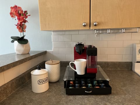 Nespresso machine from Delonghi. Makes great coffee. 