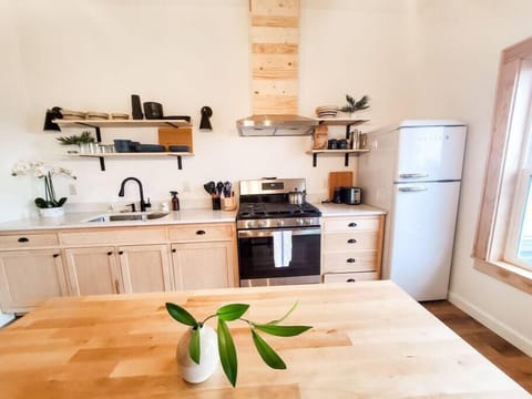 Fully stocked kitchen with gas range and full-size appliances