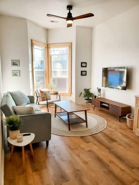 Beautiful living room with fold down couch and smart TV.