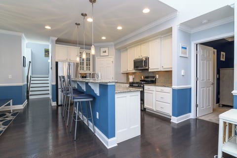 Gourmet kitchen is fully equipped w/many appliances, a pantry, dishes, & pans.