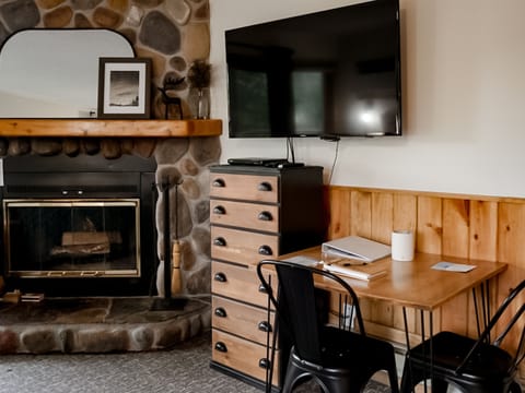 Enjoy a real fire, satellite TV, or play a game at the hand-crafted dining table