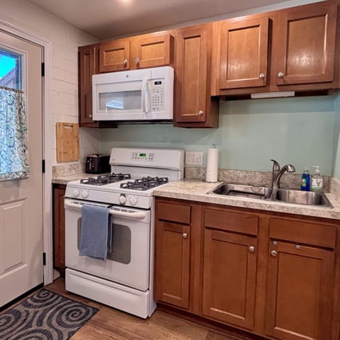 Kitchen with gas range, microwave