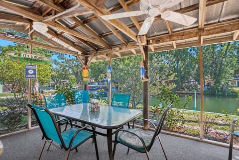 Our screened lanai offers plenty of space to relax, including an outdoor dining set, grill, fans, and porch swing.