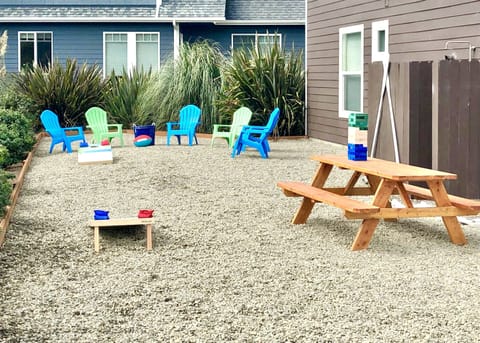 Corn-hole, outdoor games, Adirondack chairs, crab pots, & sand toys for your use