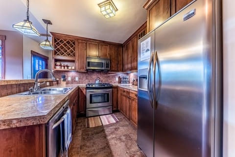 Kitchen - Offers a variety of kitchen utensils, a crock pot, coffee maker, and toaster,