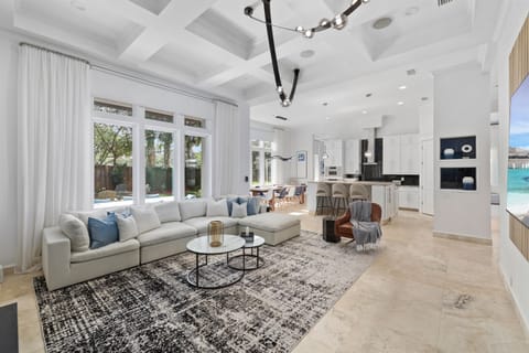 Light filled living room with soaring ceilings and space to gather