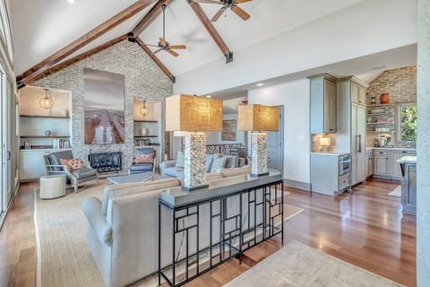 With an expansive great room including high ceilings, stunning views, and access to the balcony.