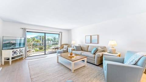 Spacious and inviting living room with a cozy coastal touch.