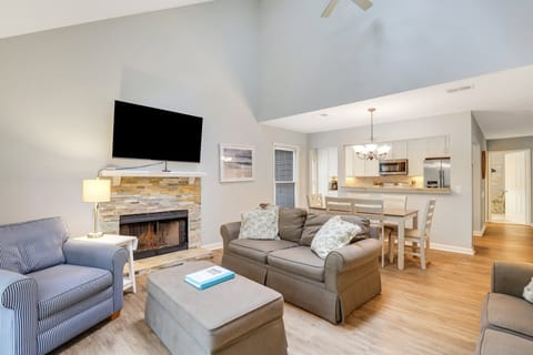 Living room with flatscreen tv and sleeper sofa.