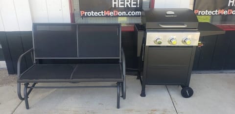 Enjoy outside on the covered patio.  Glider and grill out the front door.