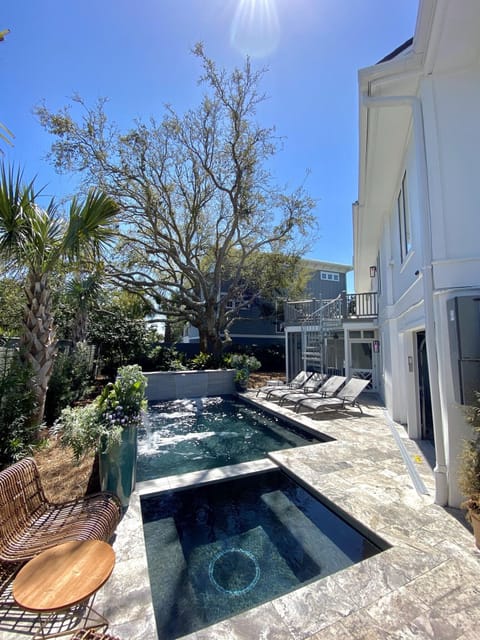 A private pool & hot tub greets you after a long, salty day at the beach!