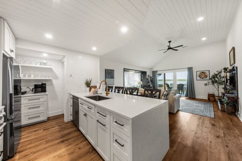Well stocked kitchen with all the spices and even a tea kettle.