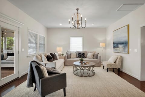 This beautiful living space leads to our large indoor back porch