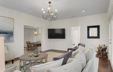 Large living space with comfy seating and 65 inch smart tv