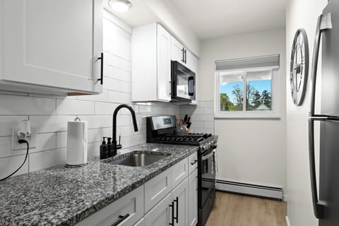 Fully Equipped Kitchen with Granite Countertop and Brand-New Slate Appliances