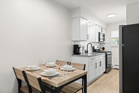 Modern kitchen meets rustic charm—cook, dine, and unwind all in one stylish space.