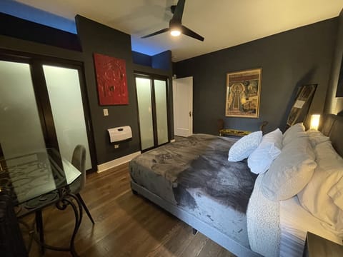 Main bedroom - king bed, nightstands, bench, ceiling fan, full length mirror