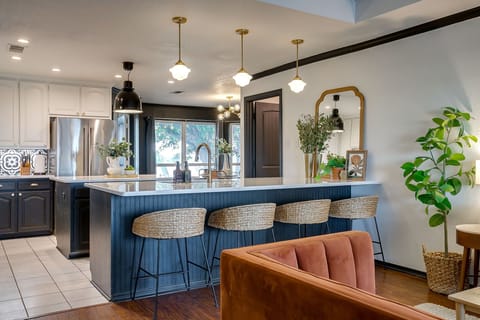 A kitchen that gathers — oversized island, full amenities, and plenty of prep space for shared meals.