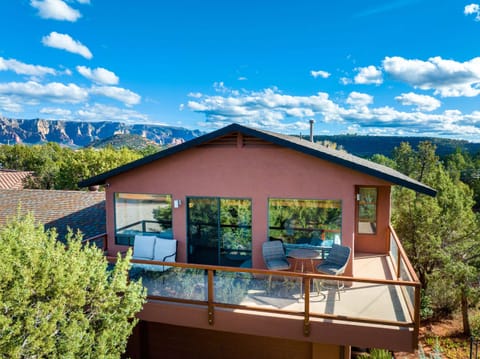 Welcome to Sanborn, where an expansive wraparound balcony showcases stunning red rock views and offers multiple spaces to relax, dine, and soak in Sedona's breathtaking natural beauty from sunrise to sunset.