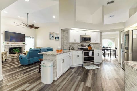 Step into your partially open kitchen, seamlessly connected to the living room. Enjoy ample space for meal prep with a double stove and a convenient microwave. There’s also seating at the bar, perfect for casual dining or entertaining.