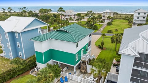 Coastal vacation rental community featuring beachfront properties, lush landscaping, and convenient access to sandy shores. This oceanfront neighborhood offers a peaceful retreat just steps from the water.