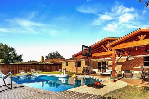 Private backyard haven with ample sitting and entertainment possibilities.