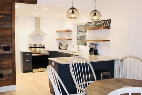 Newly renovated kitchen with all new appliances and breakfast bar.