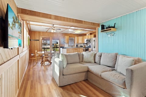 Relax after a day in the surf in this cozy, beach-inspired Living Area with comfortable seating and a flat screen TV.