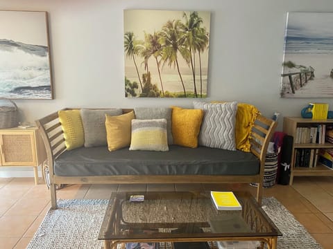 Extra spacious sunoom with library of books and games & views across to the bay