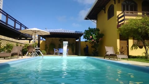 Outdoor pool, open 8 AM to 8 PM, pool umbrellas, sun loungers