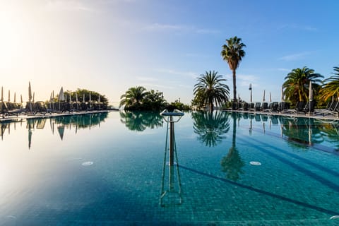 Indoor pool, outdoor pool, pool umbrellas, sun loungers