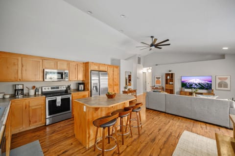 Kitchen room with kitchen island opens to the spacious living  room