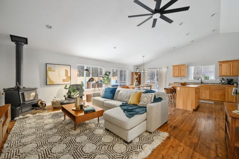 Inviting room that invites you to nestle in and relax by the wood stove.