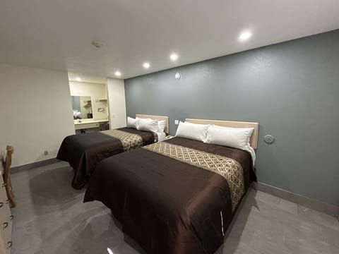 Standard Room, 2 Queen Beds, Non Smoking | Desk, iron/ironing board, cribs/infant beds, rollaway beds