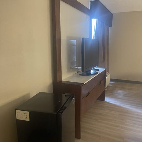 Desk, laptop workspace, blackout drapes, iron/ironing board