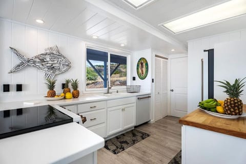 Fully-equipped kitchen on the main house's first floor provides a convenient and functional cooking space.