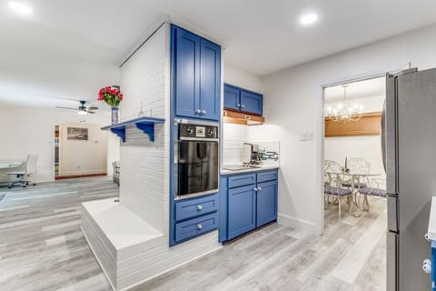 Kitchen into family room on left, dining room on right. Original working oven.