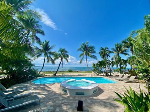 Relax in the pool and hot tub while enjoying breathtaking views of the Gulf.