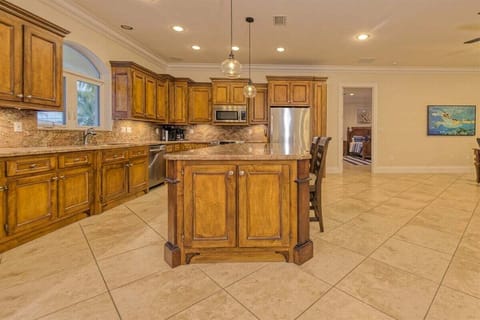 Large kitchen ideal for family meals and entertaining, located in a premier Sombrero Isles waterfront vacation property.
