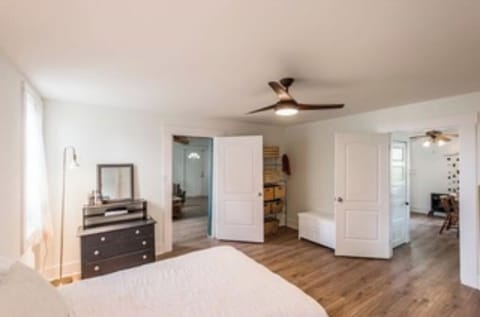 The master bedroom with view into dining room.