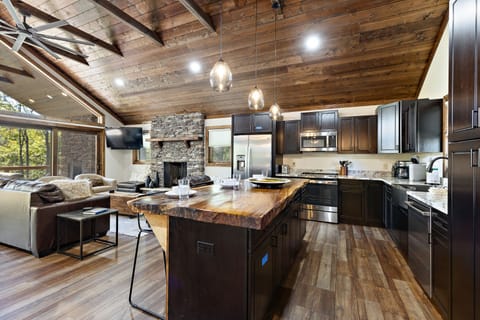 Raw Edge Wood Top Island and Stainless Appliances in the Kitchen
