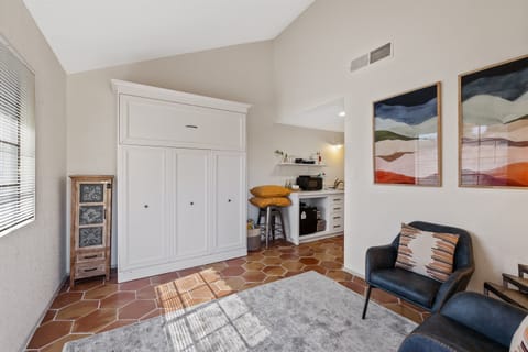 The studio bedroom with the Murphy bed in the closed/up position.