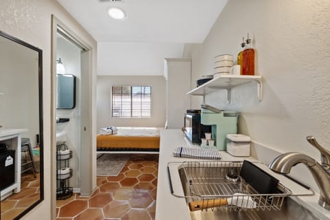 view from the back door patio, through the kitchen, to the Murphy bed.