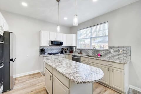 Fully equipped for all your cooking needs, this charming top-of-the-line kitchen is missing only one thing – you!