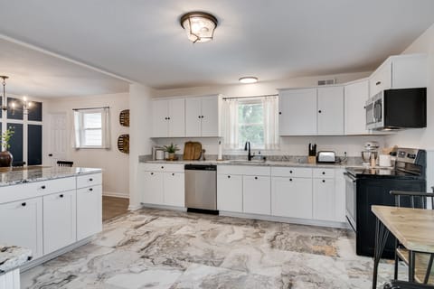 Large fully stocked kitchen with island.