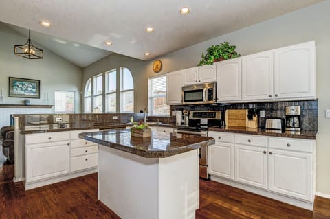 Kitchen with Stainless Appliances and lots of Room for Entertaining & Cooking.