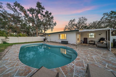 Step outside the patio doors into your private backyard space with a lounge area and pool!