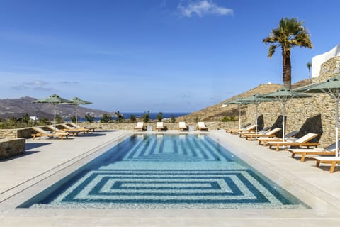 Seasonal outdoor pool, open 8:00 AM to 9:00 AM, pool umbrellas