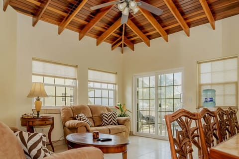 Living room with ocean views and vaulted ceiling.
