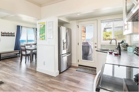 kitchen + dining rm, door close to refrigerator to the balcony with extra eating
